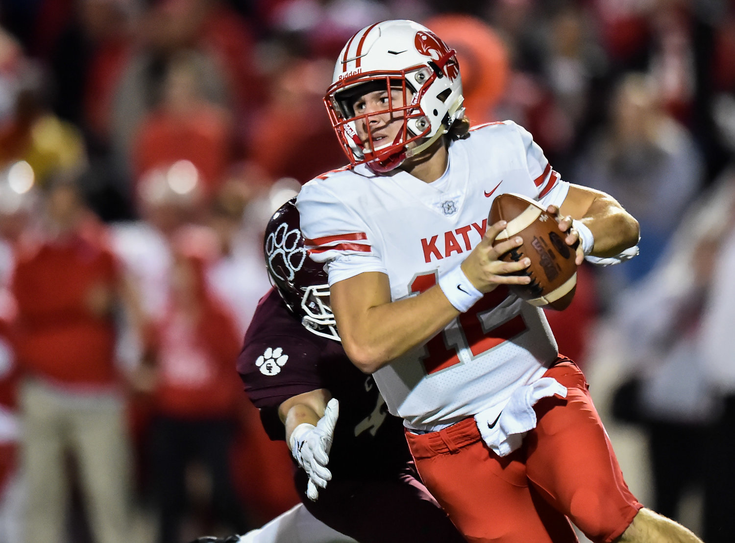 Houston, Tx. Nov. 22, 2019: Katy's QB Bronson McClelland (12) scrambles out of the pocket during the area playoff game between Katy Tigers and Cy-Fair Bobcats at Tully Stadium. (Photo by Mark Goodman / Katy Times)